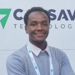 Sean Motanya smiling with arms crossed at a tech conference